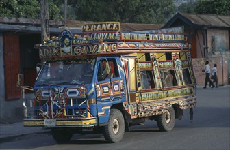 HAITI, Port au Prince, Brightly painted taptap bus.