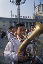 NORTH KOREA, North Hwanghhae Province, Pyongsan County, Boys in Juche band playing brass