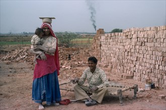 INDIA, People, Family, Construction worker couple and their baby.