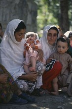 PAKISTAN, Ghizer District, Sherqillah, Ismaili women and children.