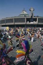 MEXICO, Mexico City, Our Lady of Guadaloupe Festival dancers celebrating outside the Basilica of