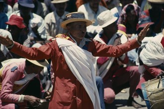 MADAGASCAR, Antananarivo, Traditional dancers and folk musicians playing to crowds.