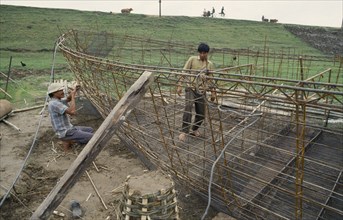 VIETNAM, North, Transport, Men making boats out of metal and concrete
