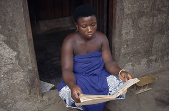 GHANA, Volta Region, A trakosi fetish slave to voodoo priest.  Virgin girls are given to village