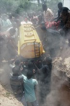 GHANA, Nungua, Burial of driver Peter Borkety Kuwono in oil tanker shaped coffin.