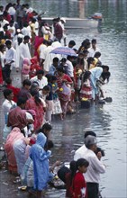 MAURITIUS, People, Crowds making offerings of flowers and fruit in the Grand Bassin lake during the