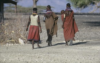 KENYA, People, "El Molo tribeswomen wearing traditional jewellery with one carrying child in sling
