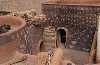 GHANA, North, Architecture, "Newly painted traditional mud architecture with woven straw doors and