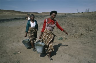 LESOTHO, Water, Women carrying buckets of water