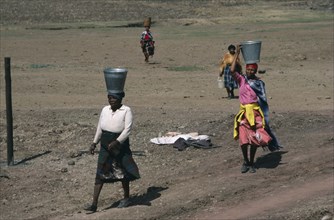 LESOTHO, Water, Women carrying buckets of water on their heads