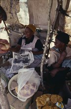 LESOTHO, Markets, Women market traders selling bread