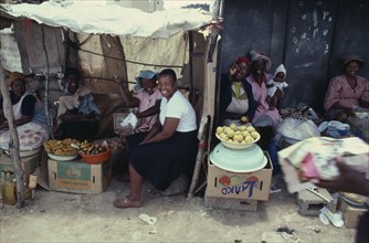 LESOTHO, Markets, Women at market stall smiling and laughing