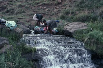 LESOTHO, Water, Girls doing laundry in river