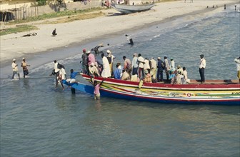 GAMBIA, Banjul, Busy local ferry arriving into shore