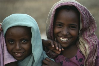 SUDAN, East, Tawawa Settlement, Head and shoulders portrait of two Ethiopian refugee girls.