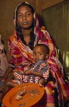 SUDAN, Khartoum, Woman and child displaced by war.