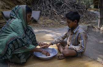 BANGLADESH, Children, Health education.  Boy learning the importance of washing hands.