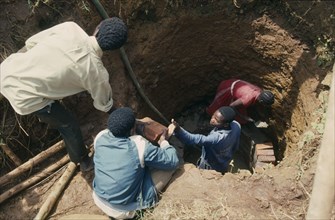 UGANDA, Water, Lining newly dug well near Jinja funded by Comic Relief.