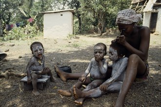 SIERRA LEONE, Mende, Children are smeared with clay to protect them from both seen and unseen