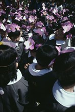 JAPAN, Honshu, Tokyo, Asakusa. Nursery school children in uniforms and flower head bands
