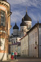 ESTONIA, Tallinn, Two women walking through the Toompea district of the Old Town with Alexander