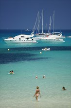 SPAIN, Balearic Islands, Ibiza, "Pleasure boats at Cala Saona, Formentera, with a few people