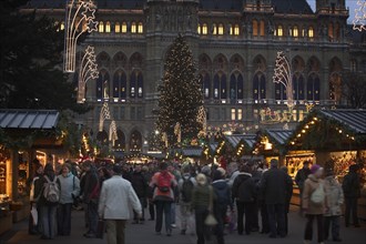 AUSTRIA, Vienna, "Crowds at the Rathaus Christmas Market, festive decorations."