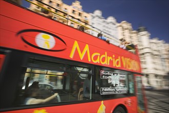 SPAIN, Madrid, Red sight seeing bus on the Gran Via.