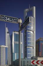 UAE, Dubai , "Modern architecture along Sheikh Zayed Road, with road sign."