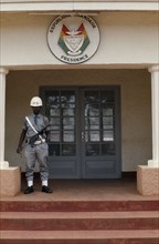 RWANDA, Kigali, Presidential building La Presidence with armed guard standing outside.