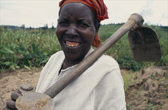 RWANDA, Giterama, "Portrait of woman with hoe, a member of the Women’s Agricultural Association