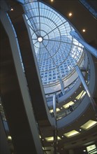 ENGLAND, London, Canary Wharf . Cabot Square Shopping area showing the escalators and glass atrium