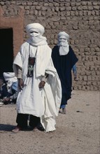 NIGER, People, Men, Two tuareg men dressed in loose cotton robes and head coverings suitable for
