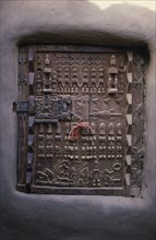 MALI, Bandiagara Escarpment, Sangha, Detail of carved granary door.