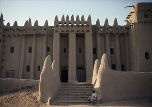 MALI, Sahel, Djenne, The Grand Mosque.  Part view of exterior with plastered mud walls.