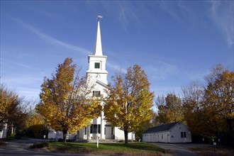 USA, New Hampshire, Dublin, "White church with clock on spire and tall columns at entrance,  golden