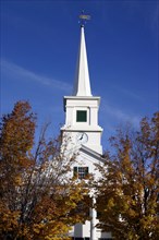 USA, New Hampshire, Dublin, "Close up of white church with clock on spire and tall columns at