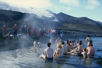 ANTARCTICA, Antarctic Peninsula, Deception Island, Tourists bathing in hot springs at Pendulum Cove