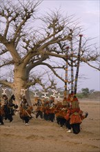 MALI, Bandiagara Escarpment, Sangha, Dogon dancers wearing kanaga and iminana masks.