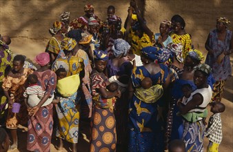 MALI, Kolokani Village, Women pound millet and sing and dance in celebration during traditional