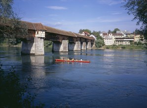 GERMANY, Baden Wurttemberg, Covered wooden bridge over the Rhine which links Badsackingen with the