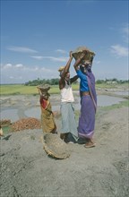 BANGLADESH, Rangpur, Male and female labourers working on embankment.