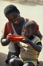 MOZAMBIQUE, Zambezia Province, Mugulama, Mother and child at feeding centre for displaced people