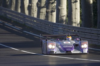 FRANCE, Le Mans, "Number 8 purple and silver Audi R8 race car with advertising and logos, exiting