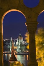 HUNGARY, Budapest, "Night time view of Parliament over the Danube from Fishermen's Bastion, viewed