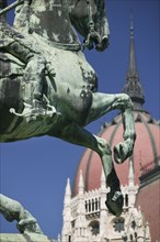HUNGARY, Budapest, "Detail of equestrian statue, Rakoczi, with Parliament behind."