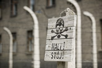 POLAND, Oswiecim, Auschwitz, Detail of a sign in the concentration camp. Black scull and crossbones