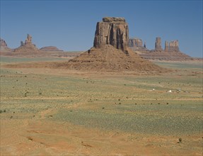 USA, Arizona, Monument Valley, View across the valley towards rock formations and a Indian