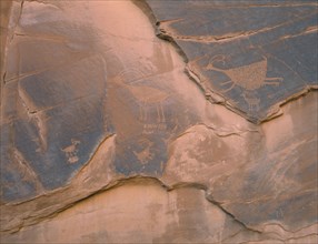 USA, Arizona, Monument Valley, Petroglyphs on a cave wall