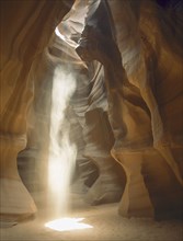 USA, Arizona, Antelope Canyon, Sunshine rays shining through a hole in the slot canyon